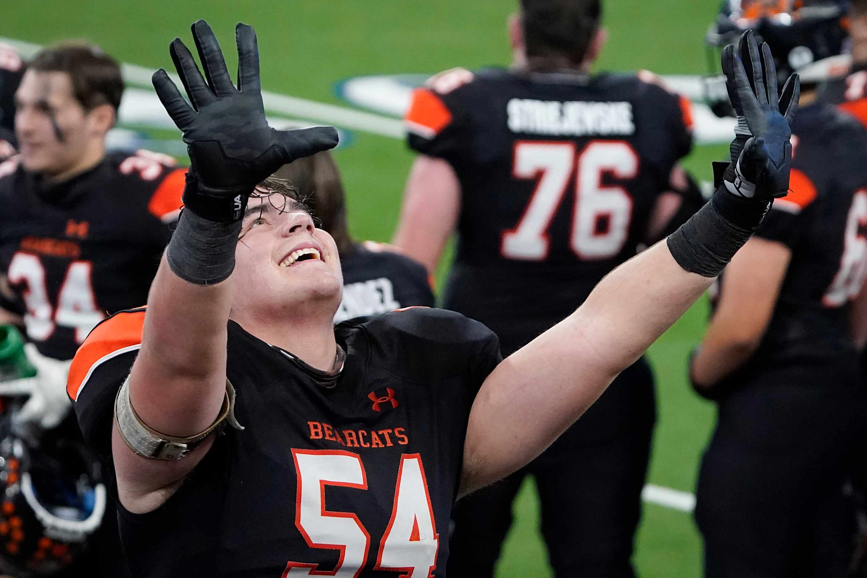 Aledo offensive lineman Rocco O'Keefe (54) holds up 10 fingers in celebration after a 56-21...