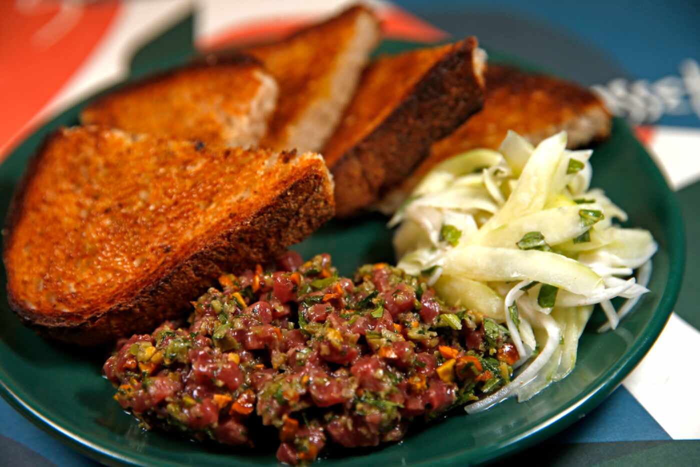 Sassetta's minty lamb tartare, served with a tangy-yogurty cucumber salad  (Jae S. Lee/The...