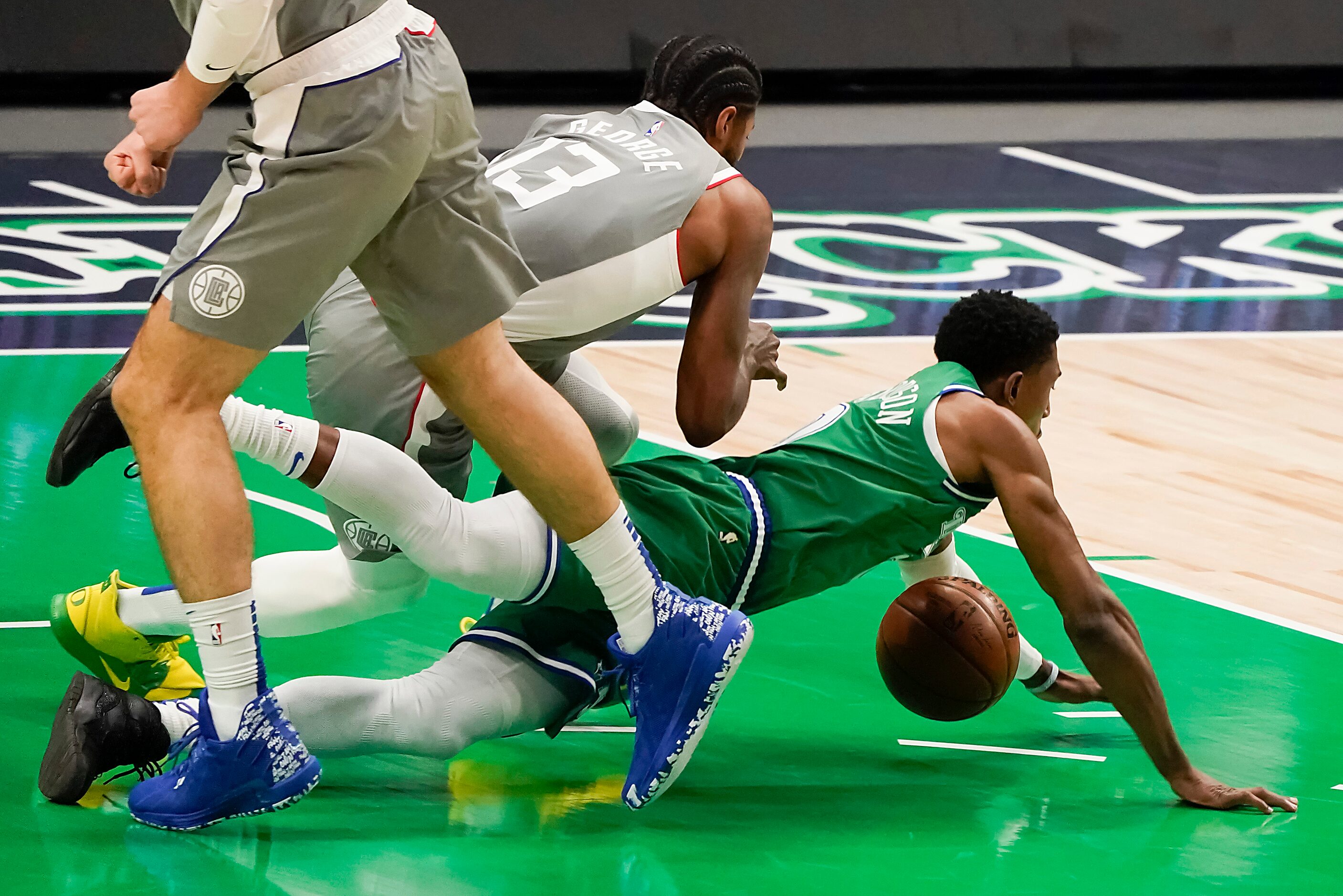 Dallas Mavericks guard Josh Richardson (0) fights for a loose ball with LA Clippers guard...