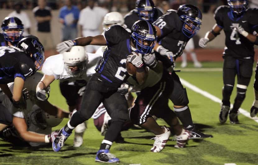 Hebron's Darius Staten (2) makes his way downfield in a game against Plano during a high...