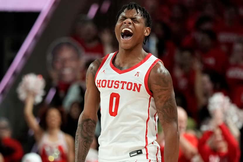 Houston guard Marcus Sasser reacts after making a 3-point basket during the first half of...