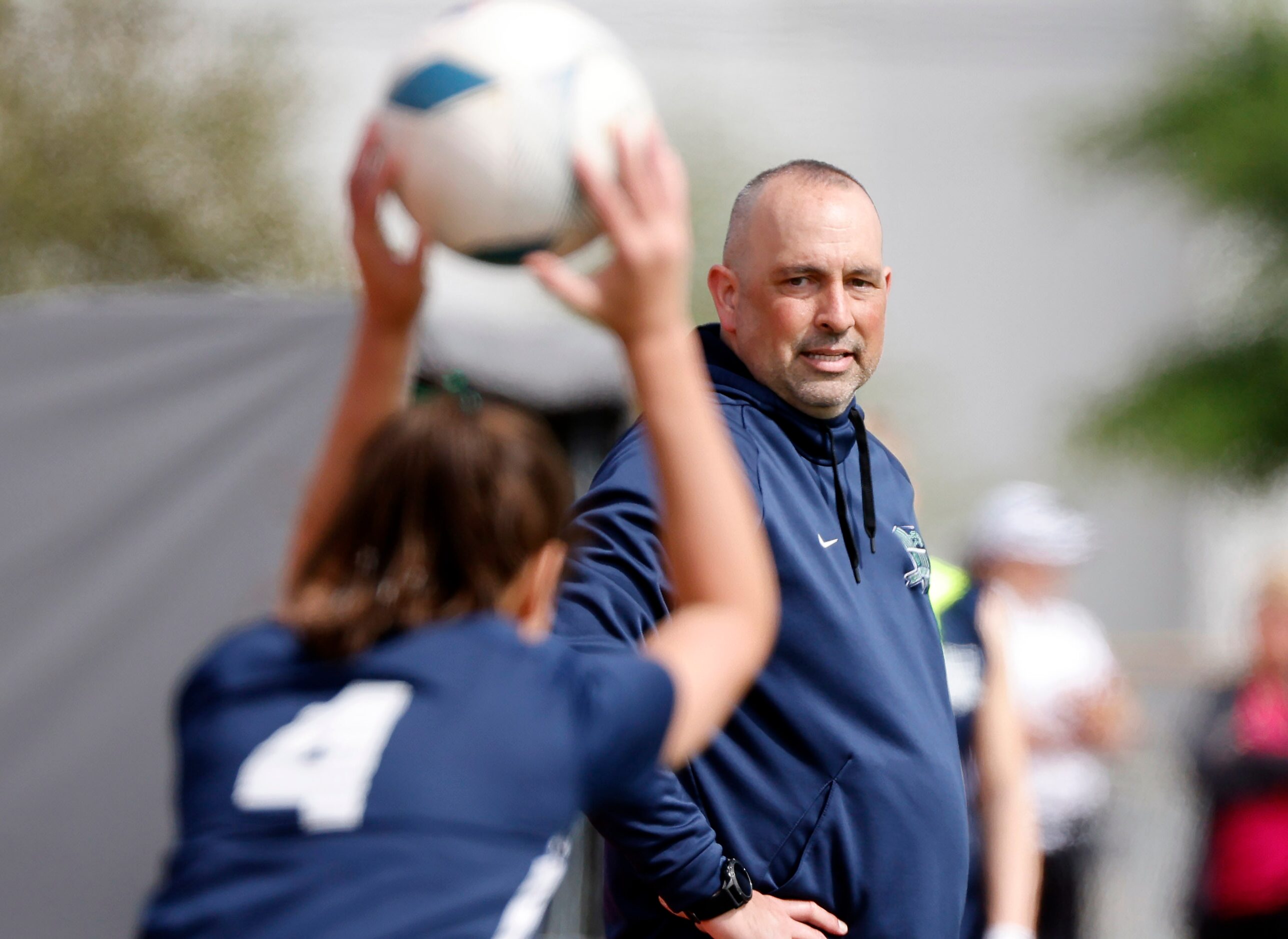 Frisco Reedy head coach Michael Khoury watches as Naia Rentschler (4) throws the ball in...