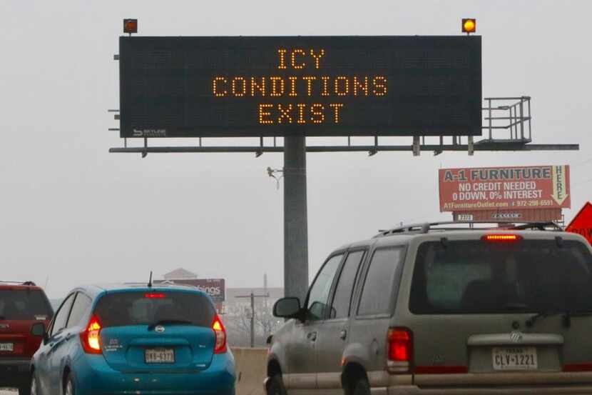 A TXDOT sign warns drivers of icy conditions on Hwy. 67 at the Danieldale Road exit ramp on...