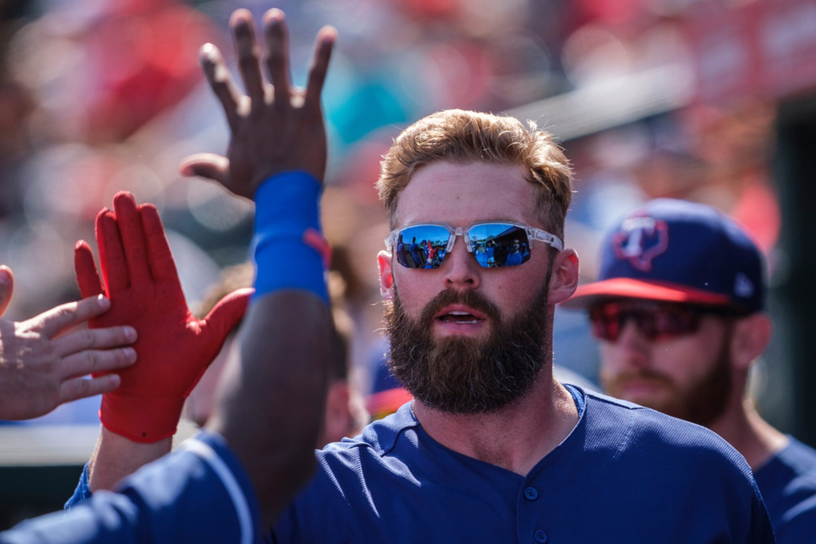 Texas Rangers infielder Matt Davidson celebrates after hitting a home run during the second...