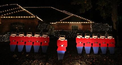 The 14 homes on Timberhollow Circle decorate in accordance with "The 12 Days of Christmas."
