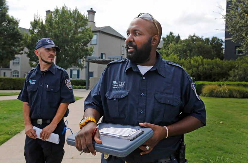 Dallas Animal Services field officer Todd McGehee (left) says he hopes he "can become half...