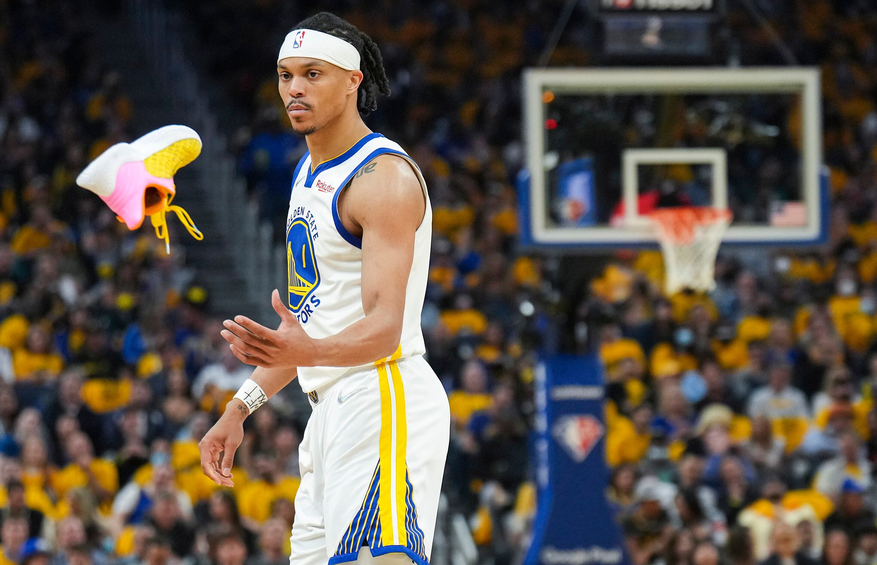 Golden State Warriors guard Damion Lee (1) has his shoe tossed back to him during the second...