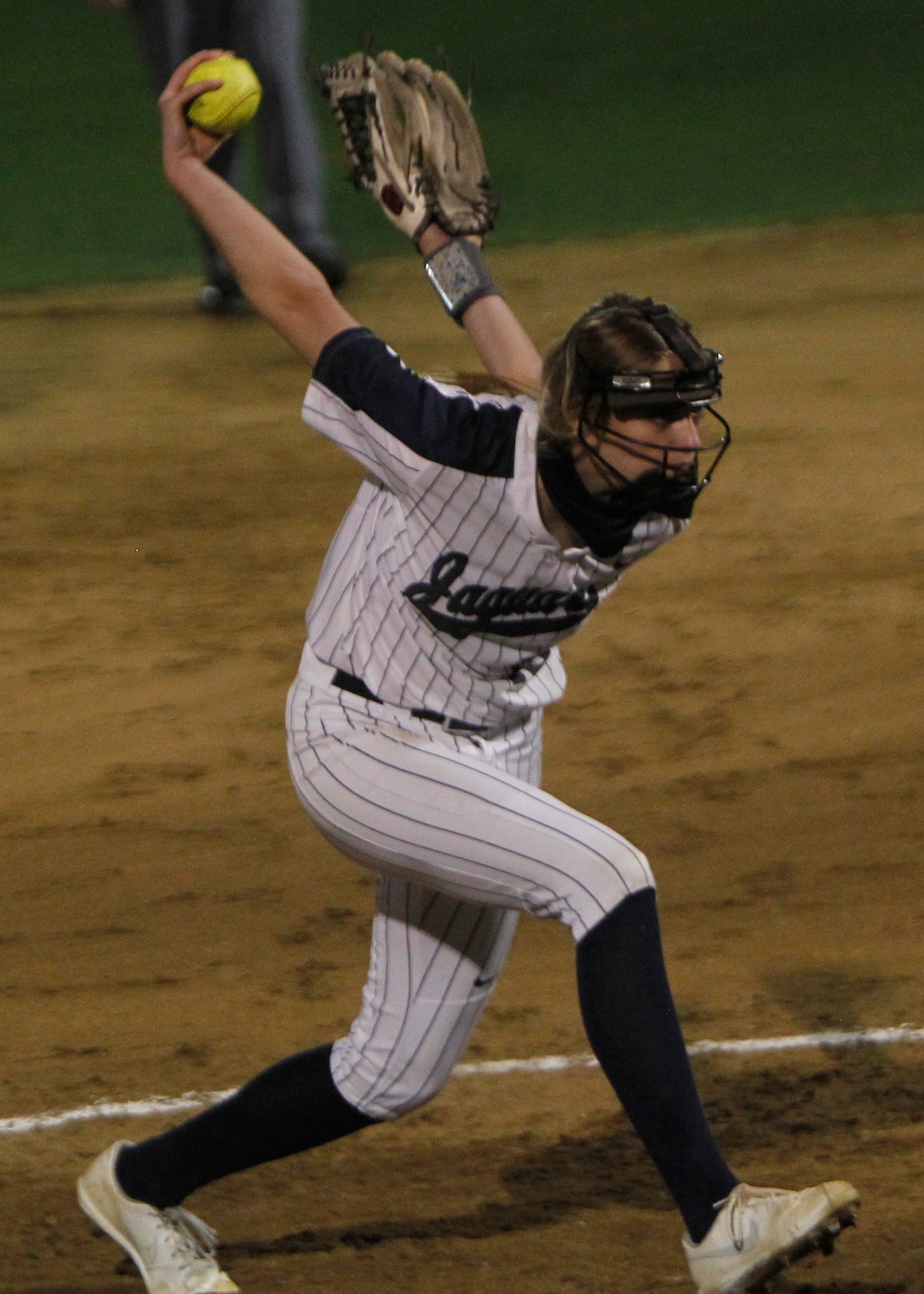 Flower Mound pitcher Landrie Harris (15) delivers a pitch to a Plano batter during the top...