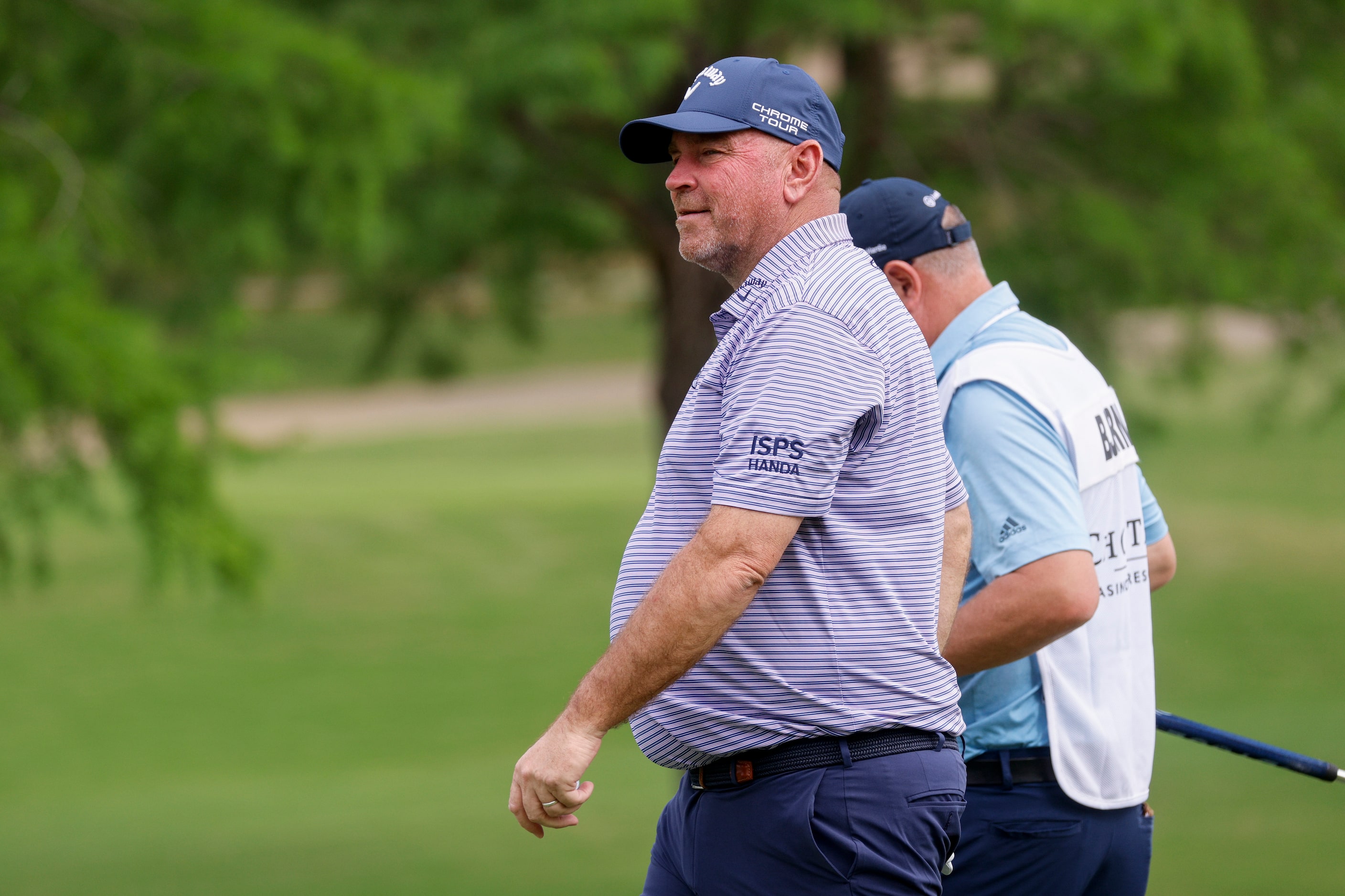 Professional golfer Thomas Bjorn walks to the 15th tee box during the first round of the...