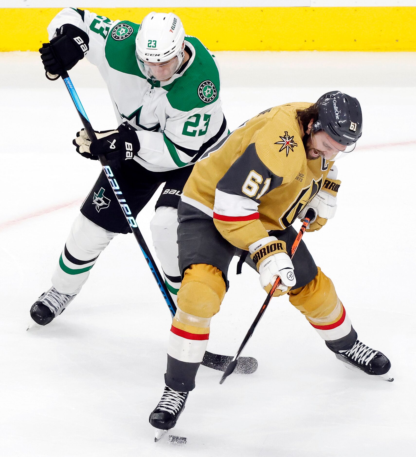 Dallas Stars defenseman Esa Lindell (23) and Vegas Golden Knights right wing Mark Stone (61)...