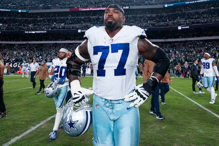 Dallas Cowboys tackle Tyron Smith (77) looks on following the NFL football game against the...
