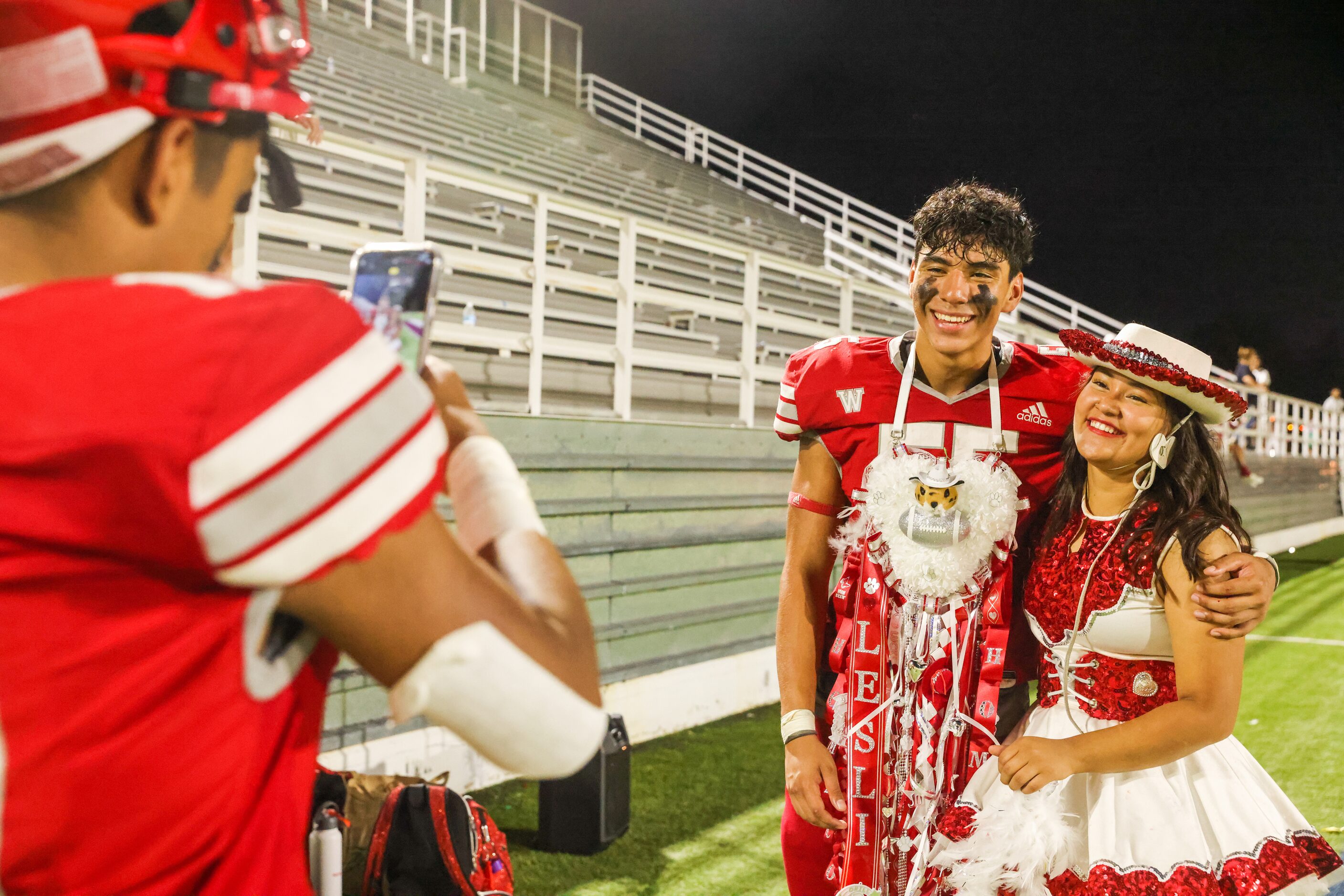 Woodrow Wilson defensive line Ivan Gonzalez (55) poses with Lesli Aguilar in their...