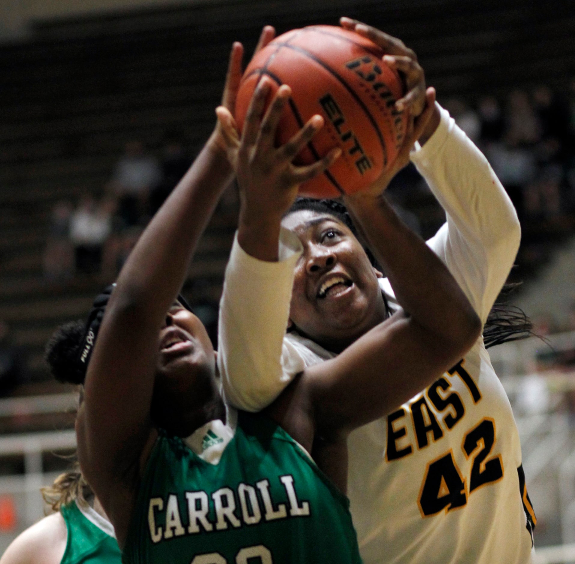 Plano East forward Idara Udo (42), right, battles for a rebound with Southlake Carroll...