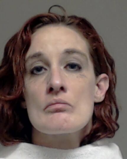 Carol Blevins, shown in a Collin County booking mug taken after she assaulted her dad in 2013.