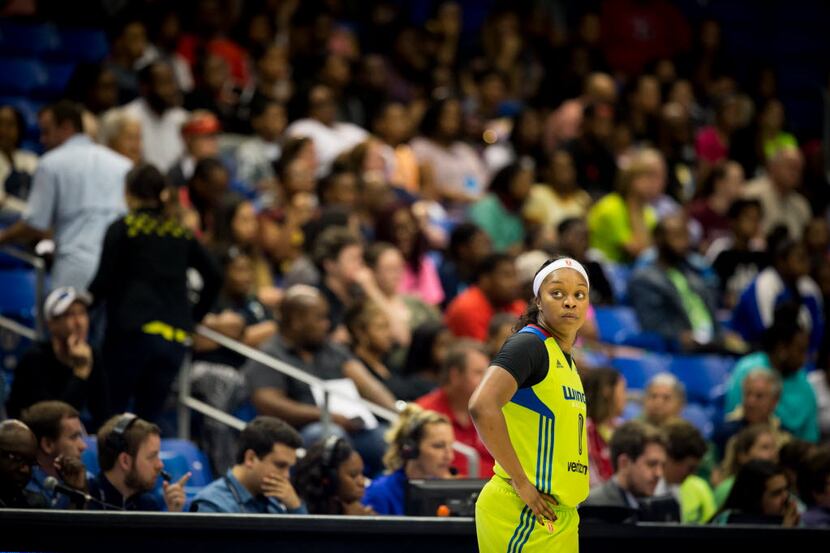 Dallas Wings guard Odyssey Sims (0) waiting for the timeout to expire on the side of the...