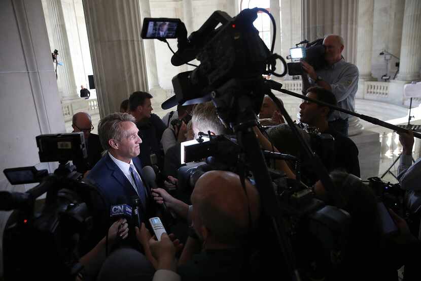 Sen. Jeff Flake, R-Ariz., speaks to reporters on Capitol Hill after announcing he will not...