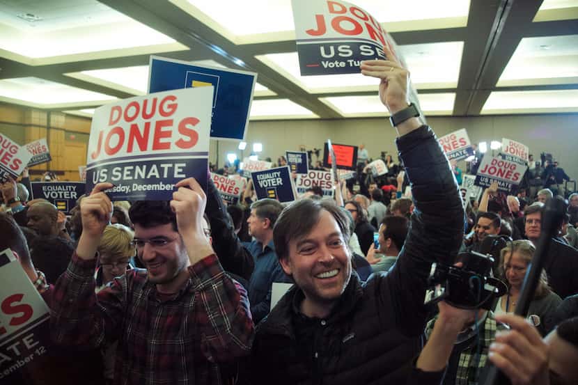 Supporters of Doug Jones, the Democratic candidate for U.S. Senate, celebrate at an election...