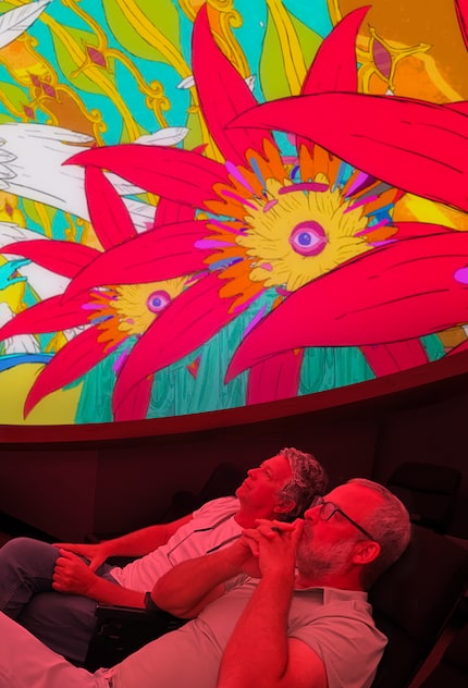 Polyphonic Spree's Tim DeLaughter (left) screens footage at the planetarium with...