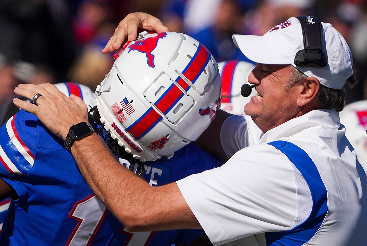 SMU head coach Sonny Dykes celebrates with wide receiver Rashee Rice (11) after he scored on...
