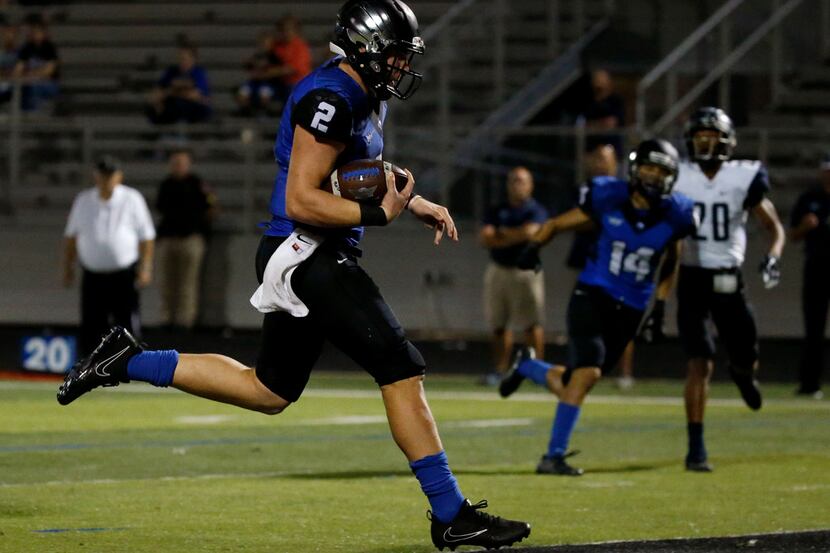 North Forney quarterback Colby Suits (2) runs the ball for a touchdown against Wylie East in...