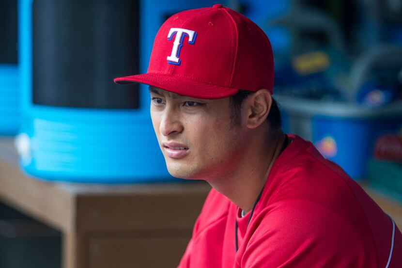 Apr 13, 2014; Arlington, TX, USA; Texas Rangers starting pitcher Yu Darvish (11) looks on...