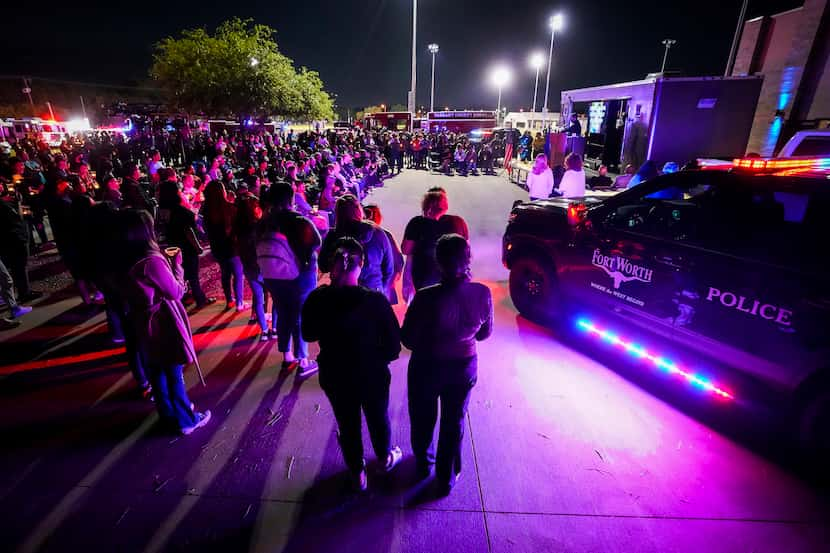 People gather as police Chief Craig Spencer speaks during a vigil for Noel Rodriguez-Alvarez...