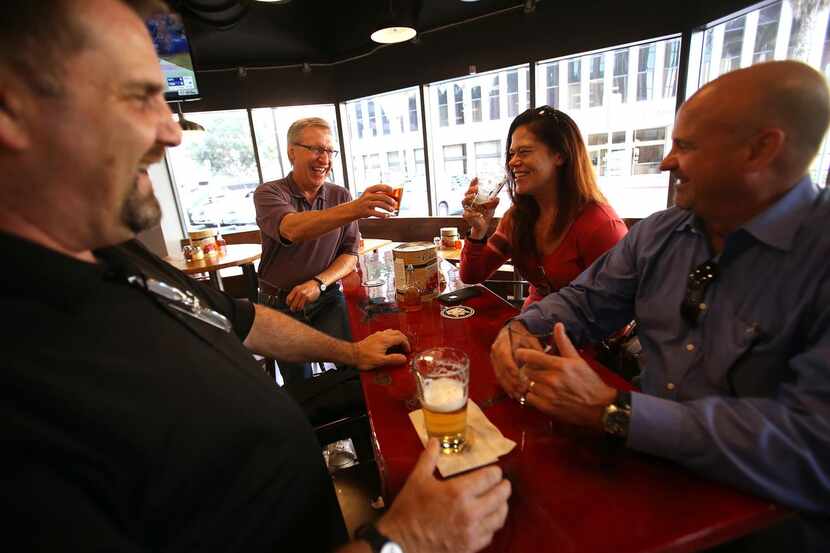 
From left, Bret Wells, Mike Corley, Lainie Byerly and Marc Crandell enjoy a beer at Zpizza.
