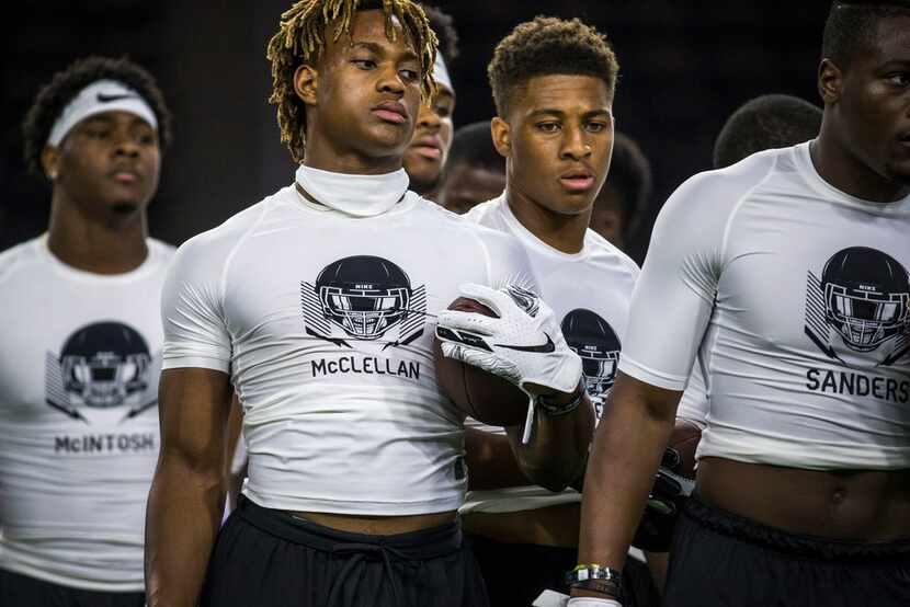 Jase McClellan (front left), of Aledo, Texas waits to run a drill during the second day of...