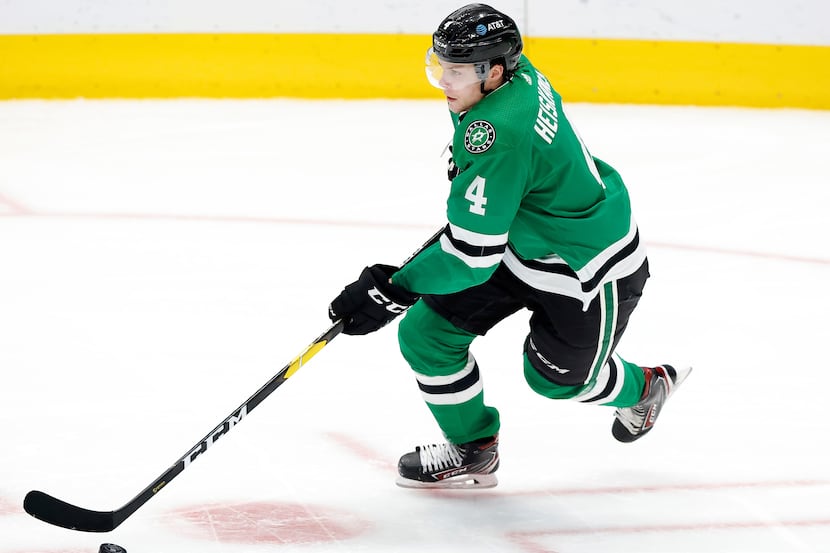 Dallas Stars defenseman Miro Heiskanen (4) brings the puck up ice against the Columbus Blue...