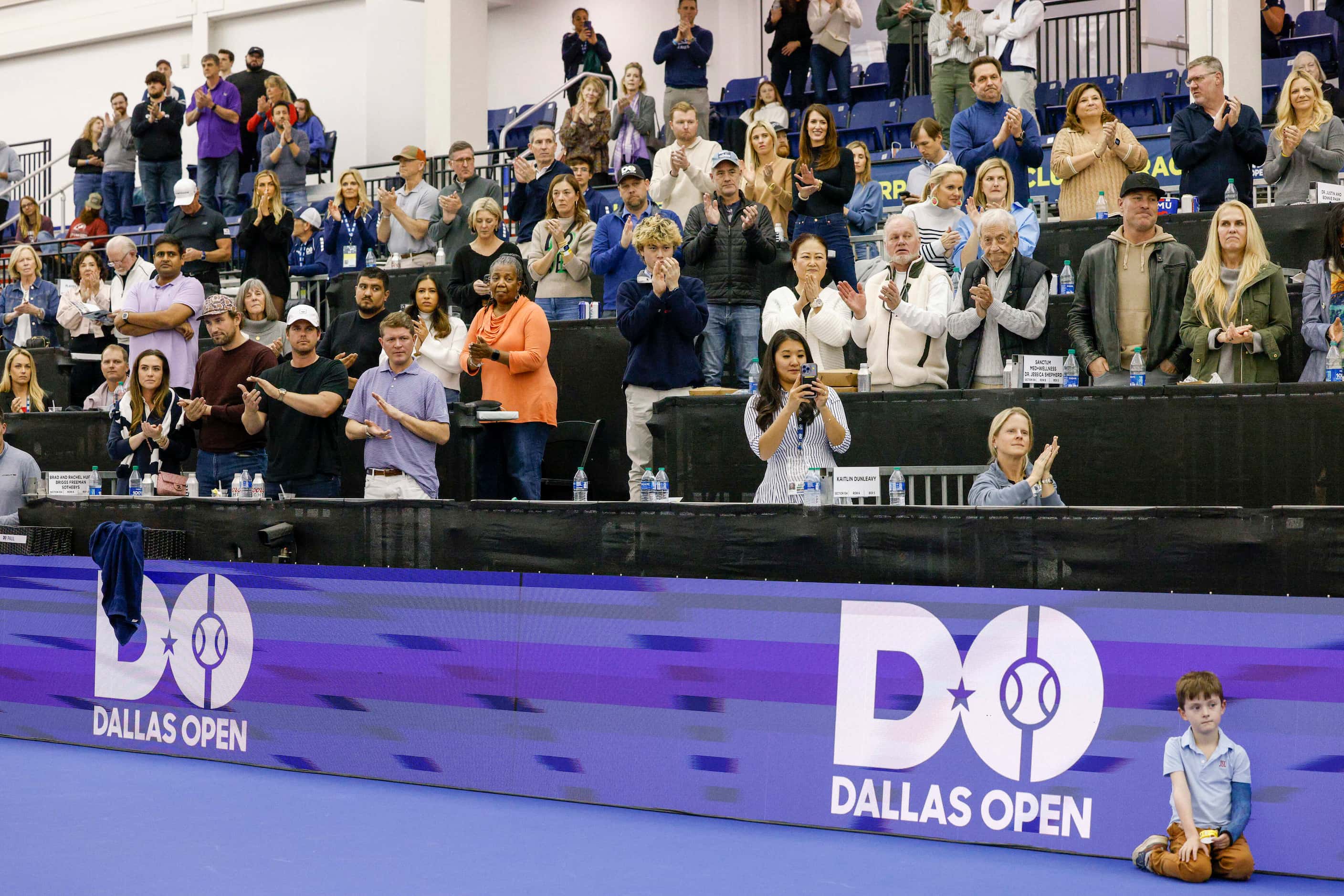 Fans cheer as Tommy Paul of the U.S. speaks after winning the ATP Dallas Open men's singles...