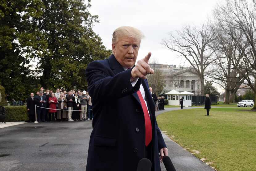 President Donald Trump talks to reporters before departing the White House en route to...