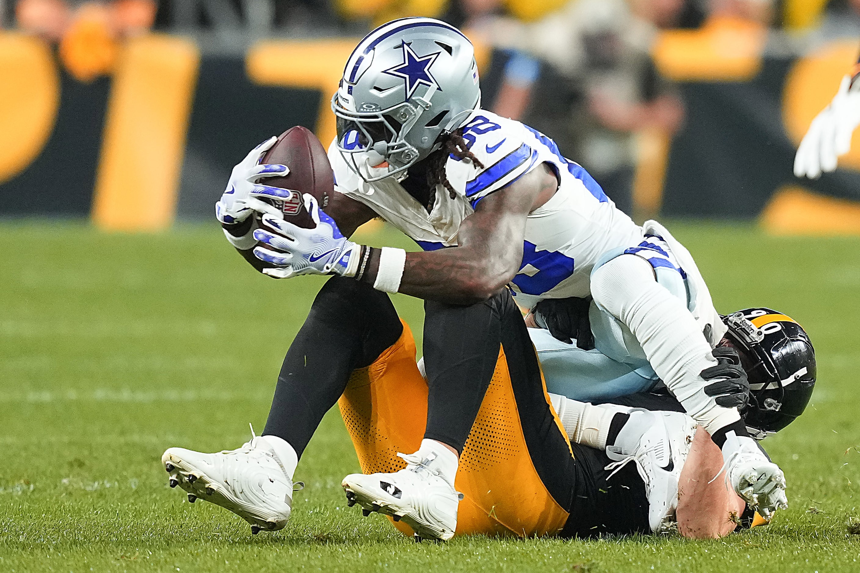 Dallas Cowboys wide receiver CeeDee Lamb (88) is brought down by Pittsburgh Steelers...