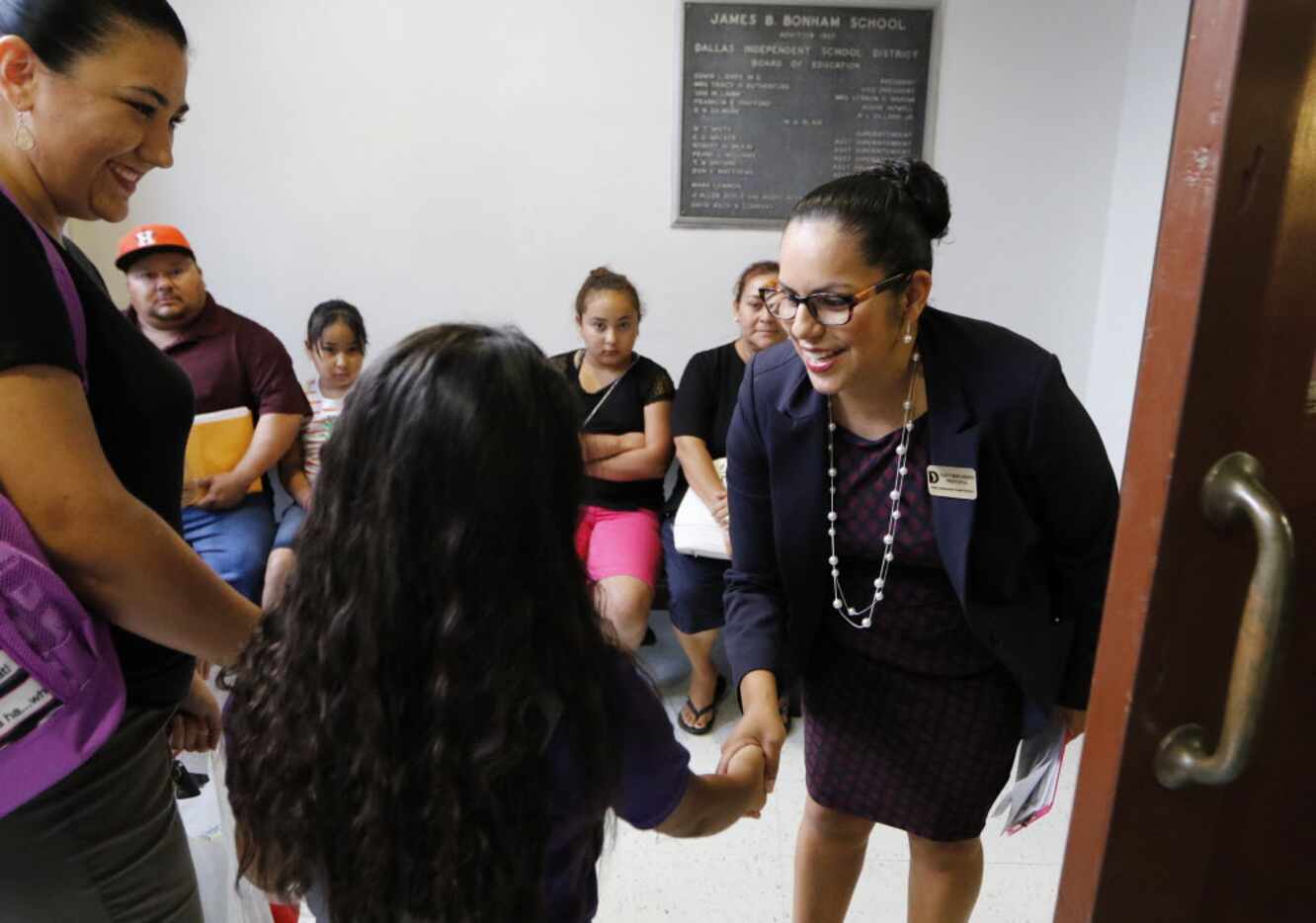 Solar Preparatory School for Girls principal, Nancy Bernardino, right, greets students on...