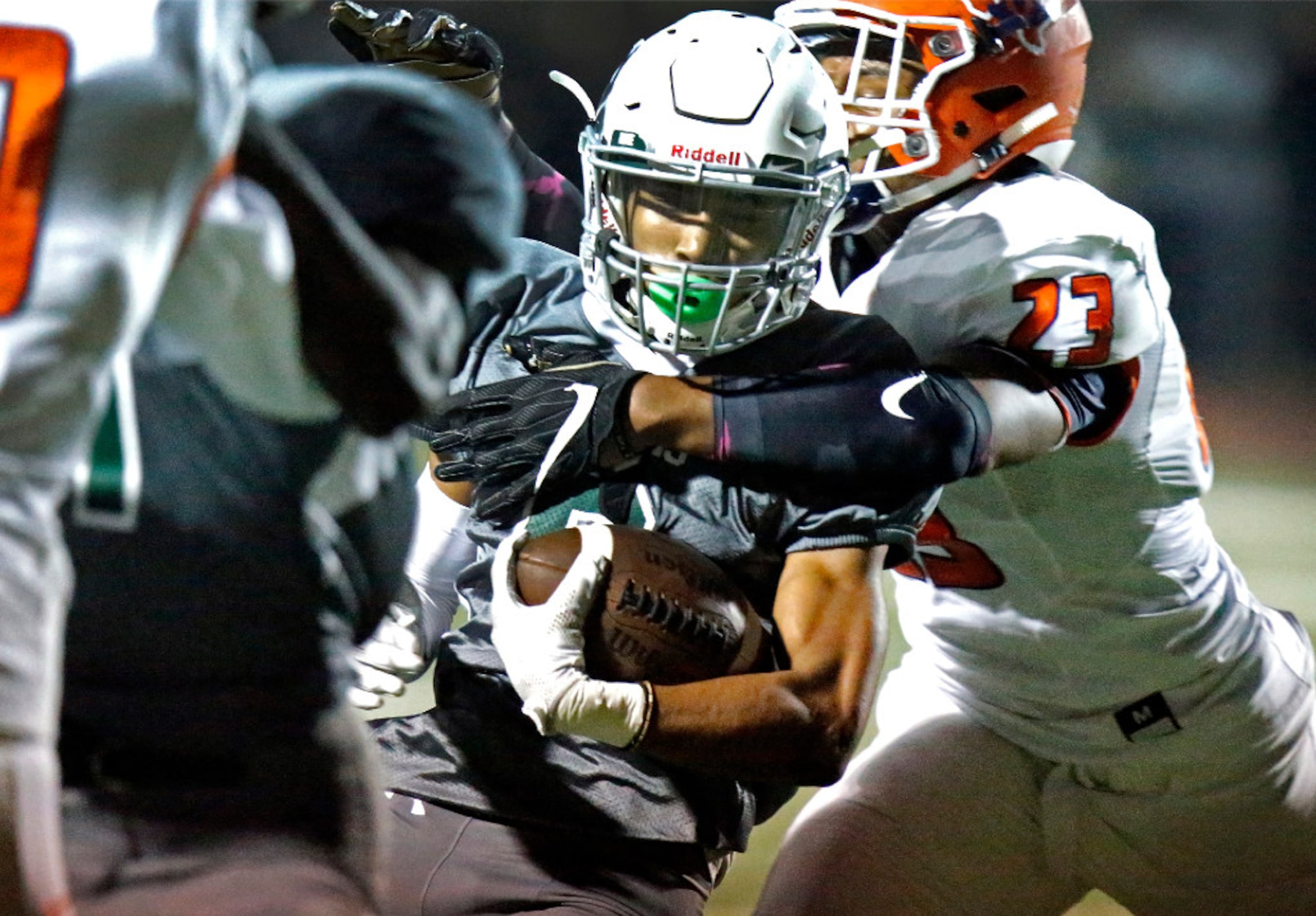 Prosper High School running back D.J. Love (9) is caught and brougt down by McKinney North...