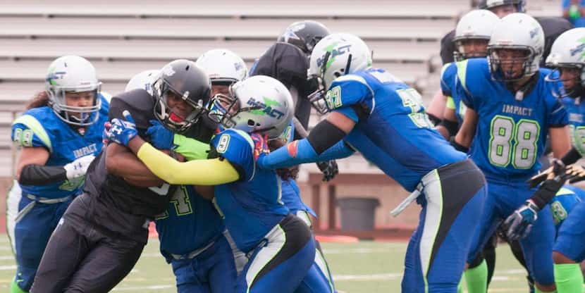 
Odessa Jenkins, head coach and player for the Dallas Elite women's football team, is...