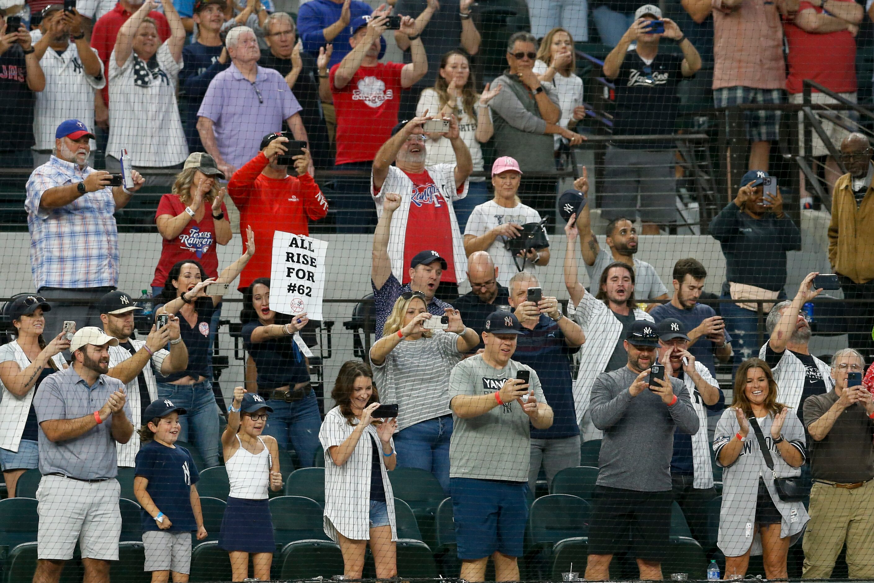 Fans cheer New York Yankees right fielder Aaron Judge (99) after his 62nd home run of the...