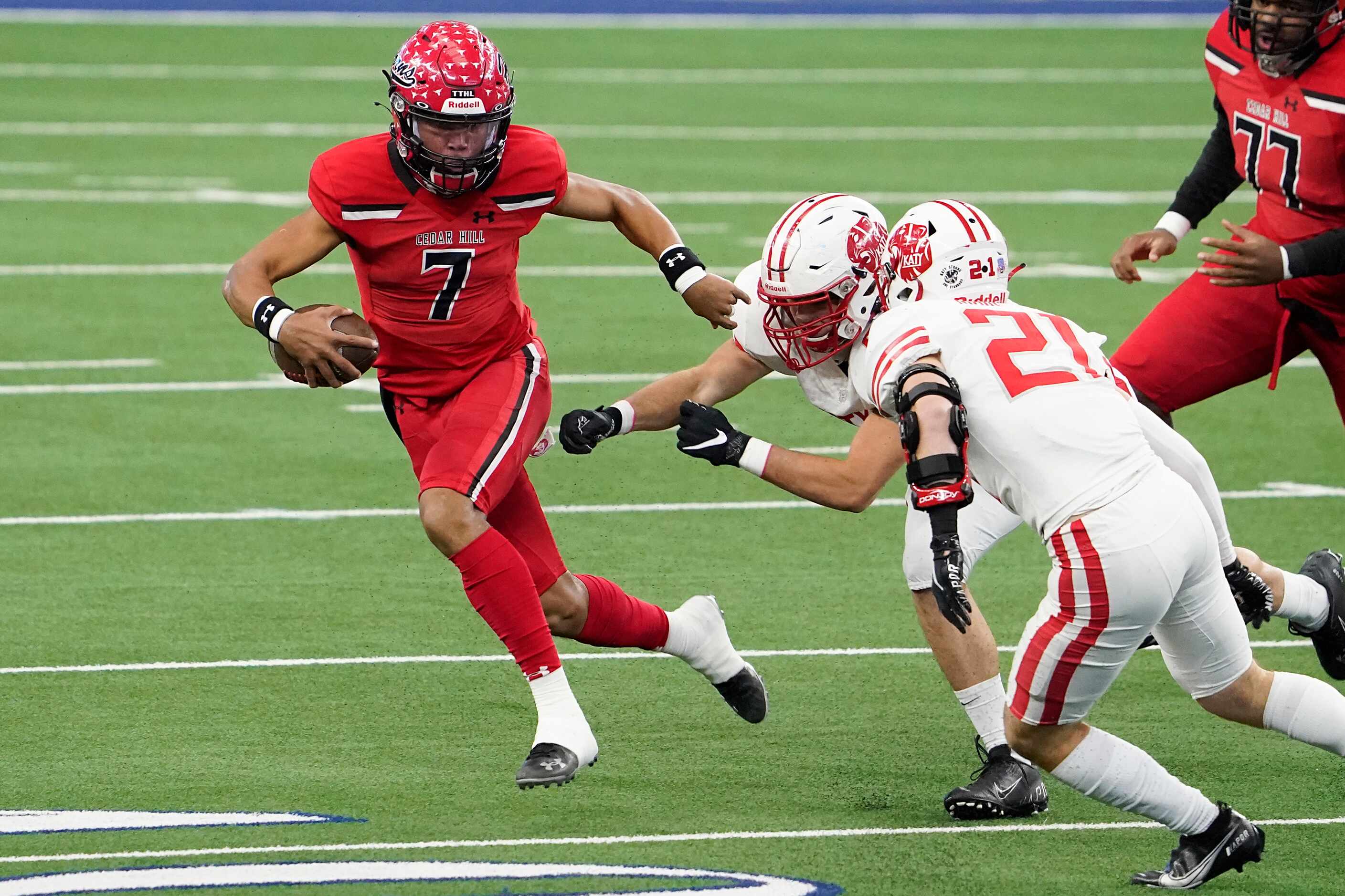 Cedar Hill quarterback Kaidon Salter (7) is chased down by Katy defensive lineman Cayde...