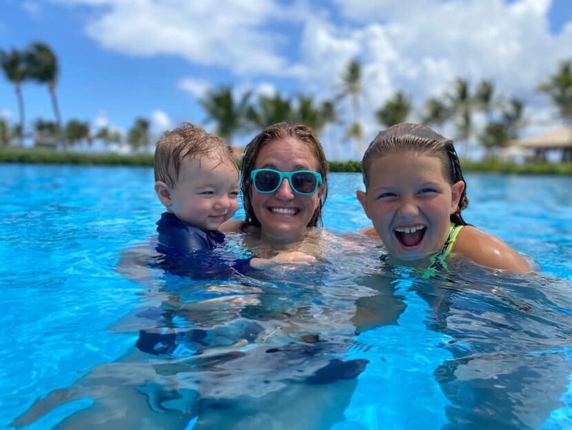 Lesley Carter swims with her children, Max and Athena, in the Dominican Republic.
