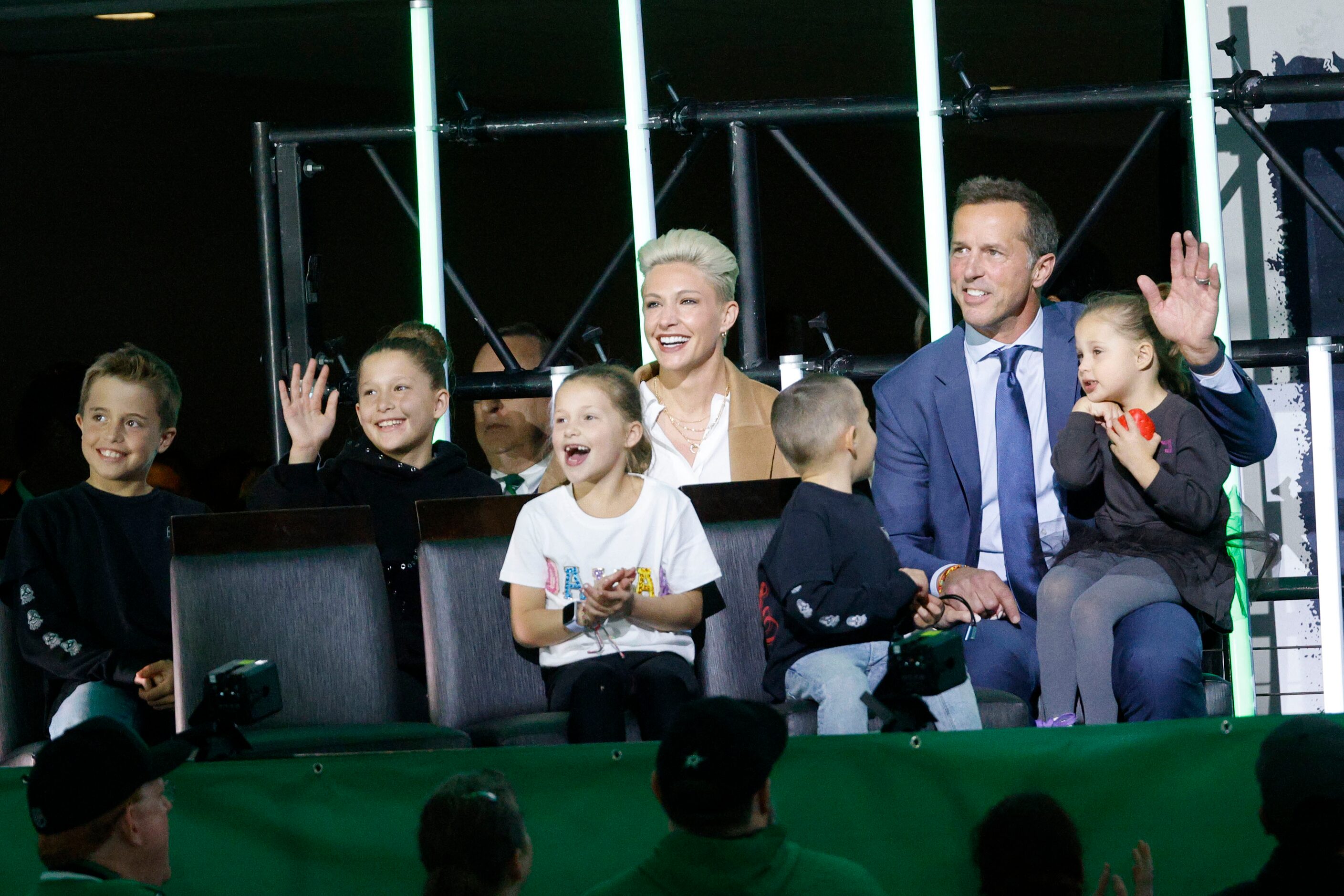 Dallas Stars legend Mike Modano waves during the unveiling ceremony of his statue at the...