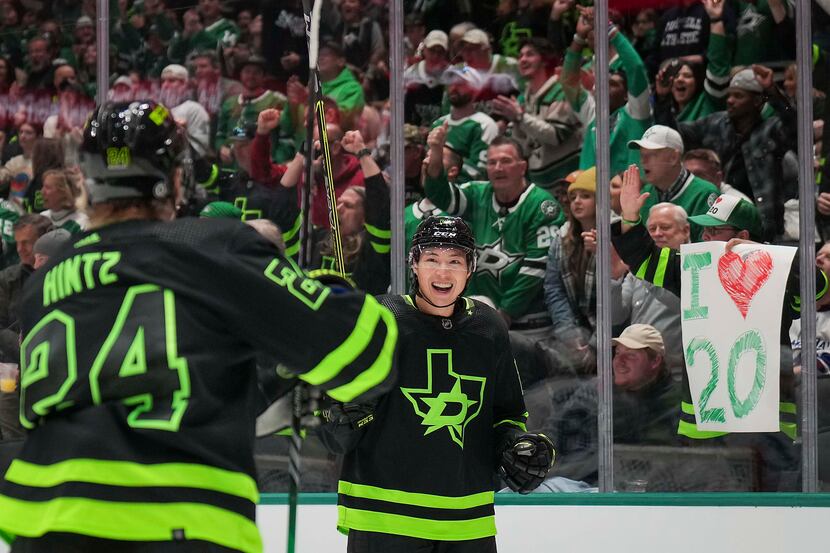 Dallas Stars left wing Jason Robertson (21) celebrates with center Roope Hintz (24) after...