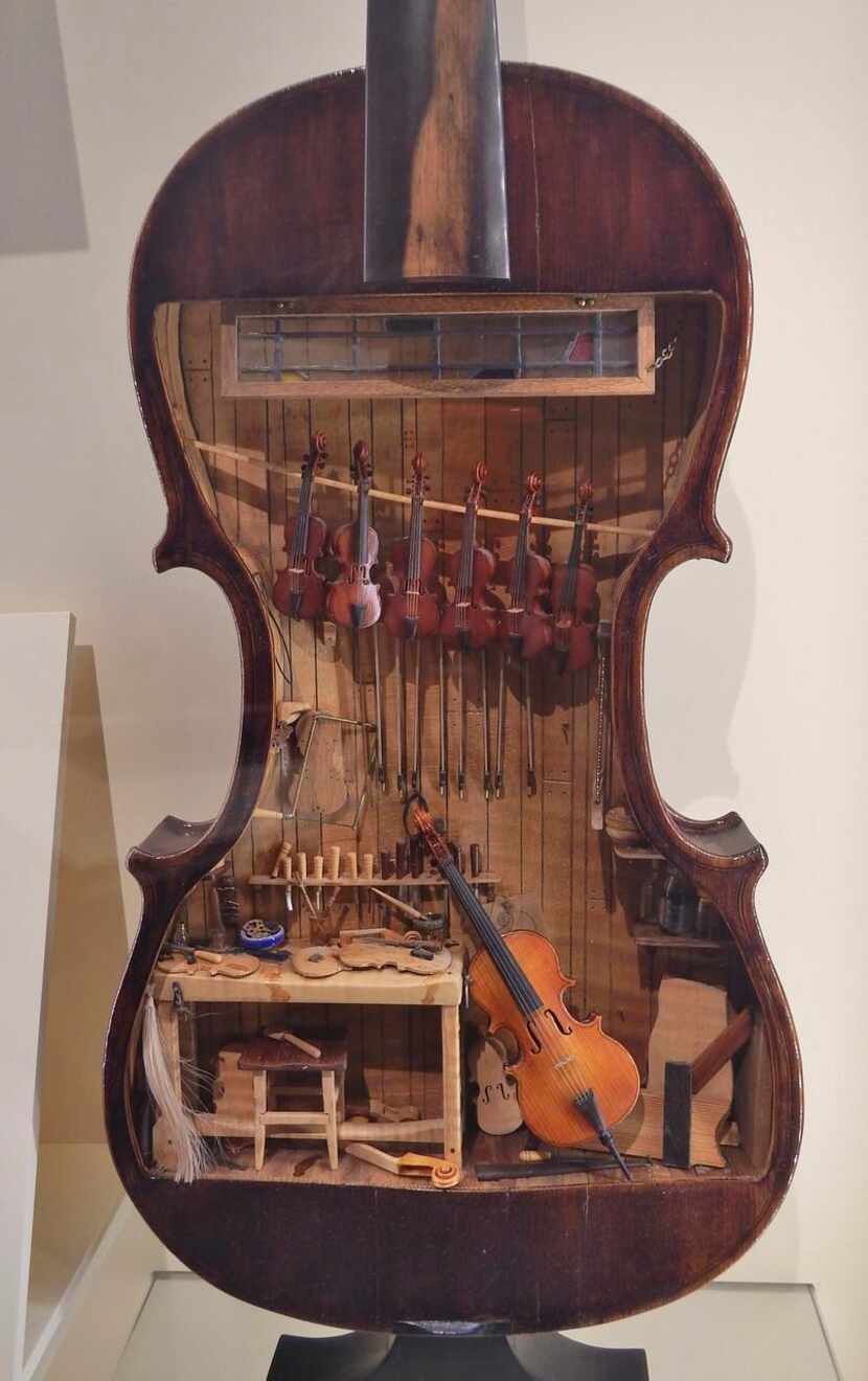 The museum  features a miniatures exhibit inside a full-scale violin.