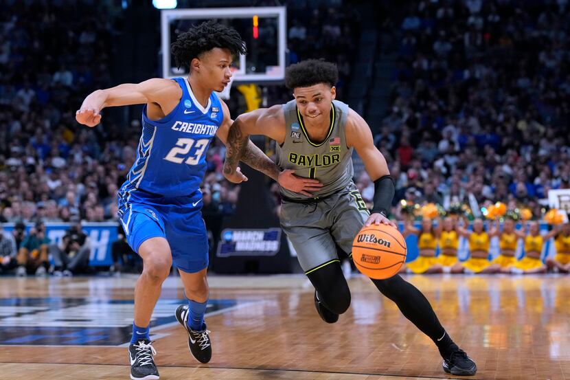 Baylor guard Keyonte George, right, drives against Creighton guard Trey Alexander during the...