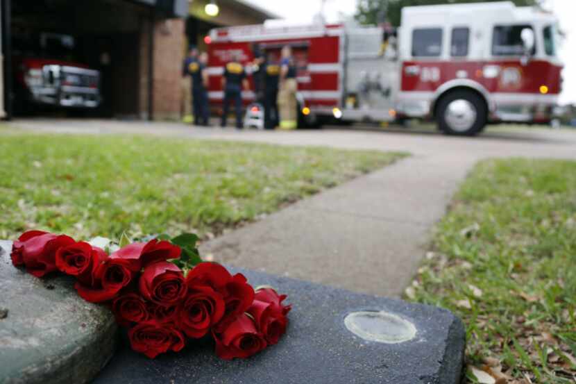 Flowers lay in front of fire station 53 in honor of fallen Dallas firefighter Stanley Wilson...