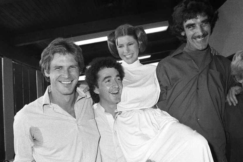 In this Oct. 5, 1978 photo, from left, actors Harrison Ford, Anthony Daniels, Carrie Fisher...