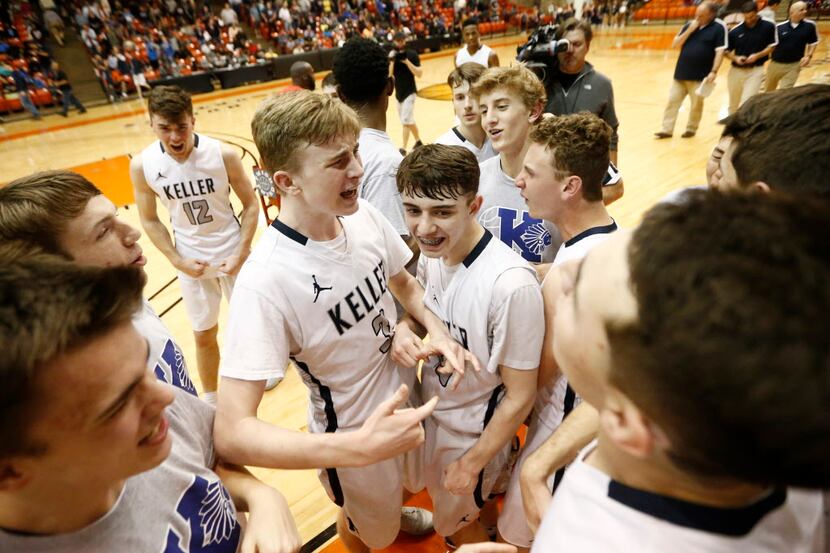 Keller junior guard Carson Hughes (3) celebrates with his teammates after a win Friday in...