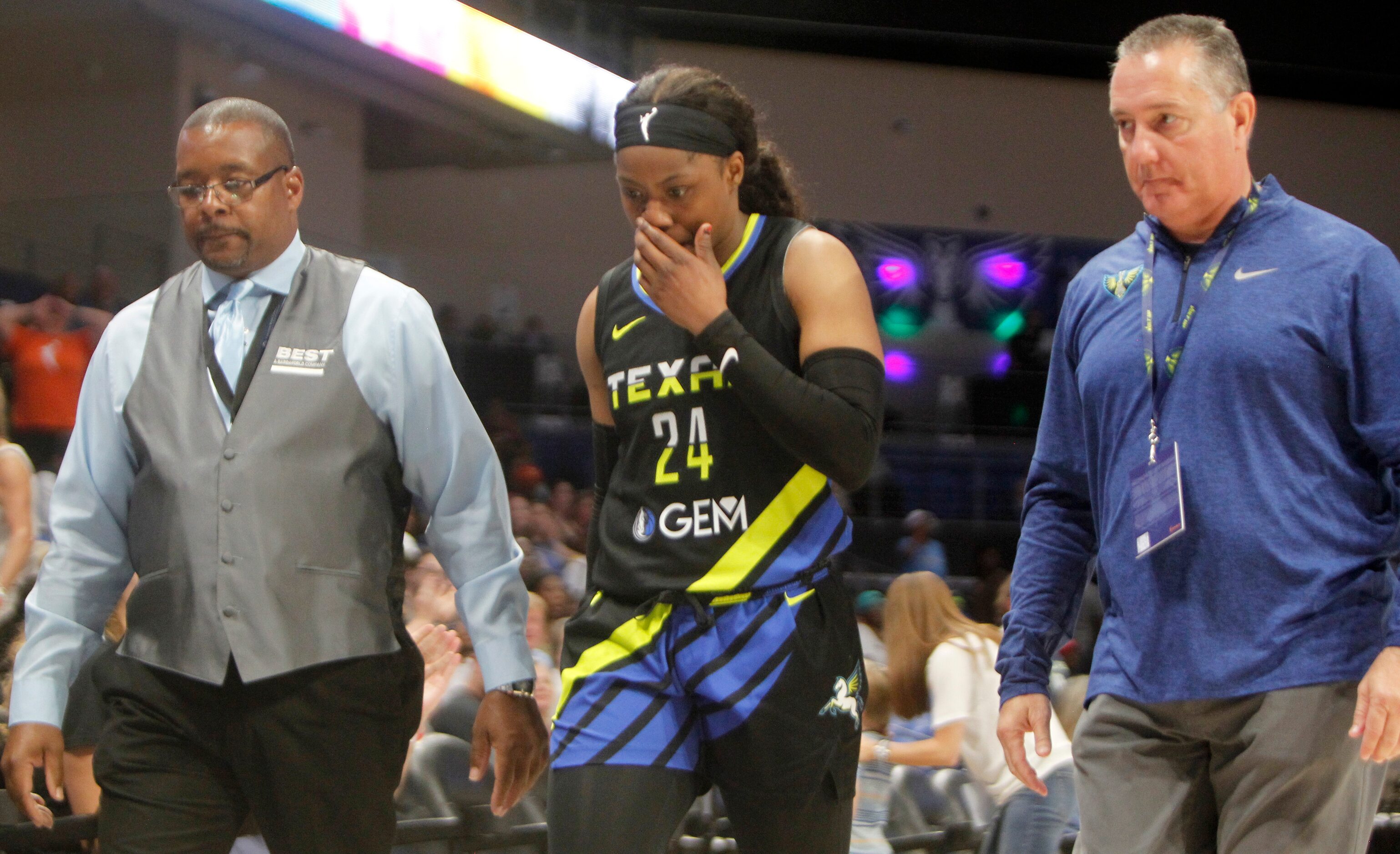 Dallas Wings guard Arike Ogunbowale (24) is escorted from the court after being ejected for...