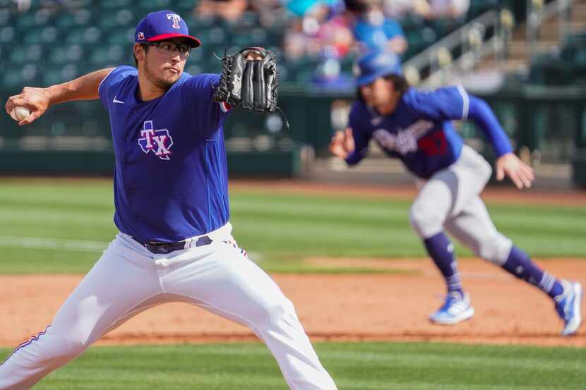 Texas Rangers pitcher Dane Dunning delivers during the sixth inning of a spring training...