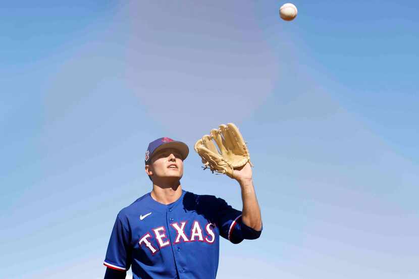 Texas Rangers right handed pitcher Jack Leiter plays catch ball during the first spring...