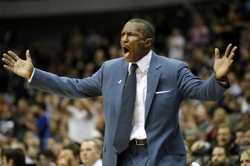 Toronto Raptors head coach Dwane Casey throws his hands up after a foul call was charged...