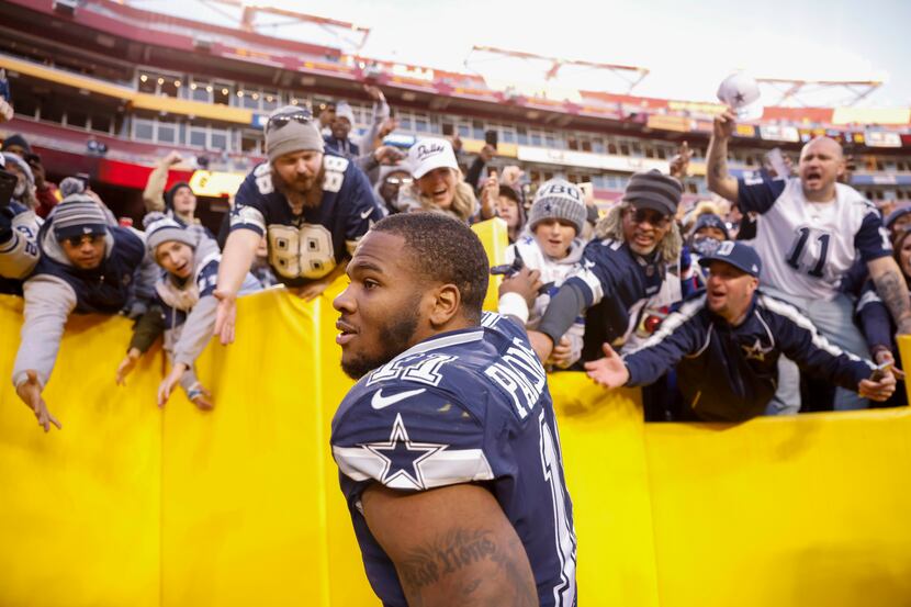 Dallas Cowboys linebacker Micah Parsons (11) greets fans after winning against the...